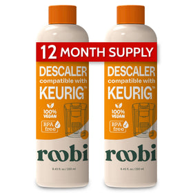 Roobi descaling bottle close-up highlighting eco-friendly Keurig cleaner for mineral buildup removal.