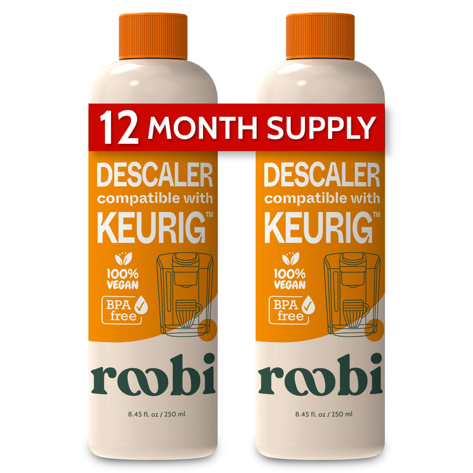 Roobi descaling bottle close-up highlighting eco-friendly Keurig cleaner for mineral buildup removal.