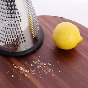 ROQILA grater with built-in container catching shavings for mess-free prep