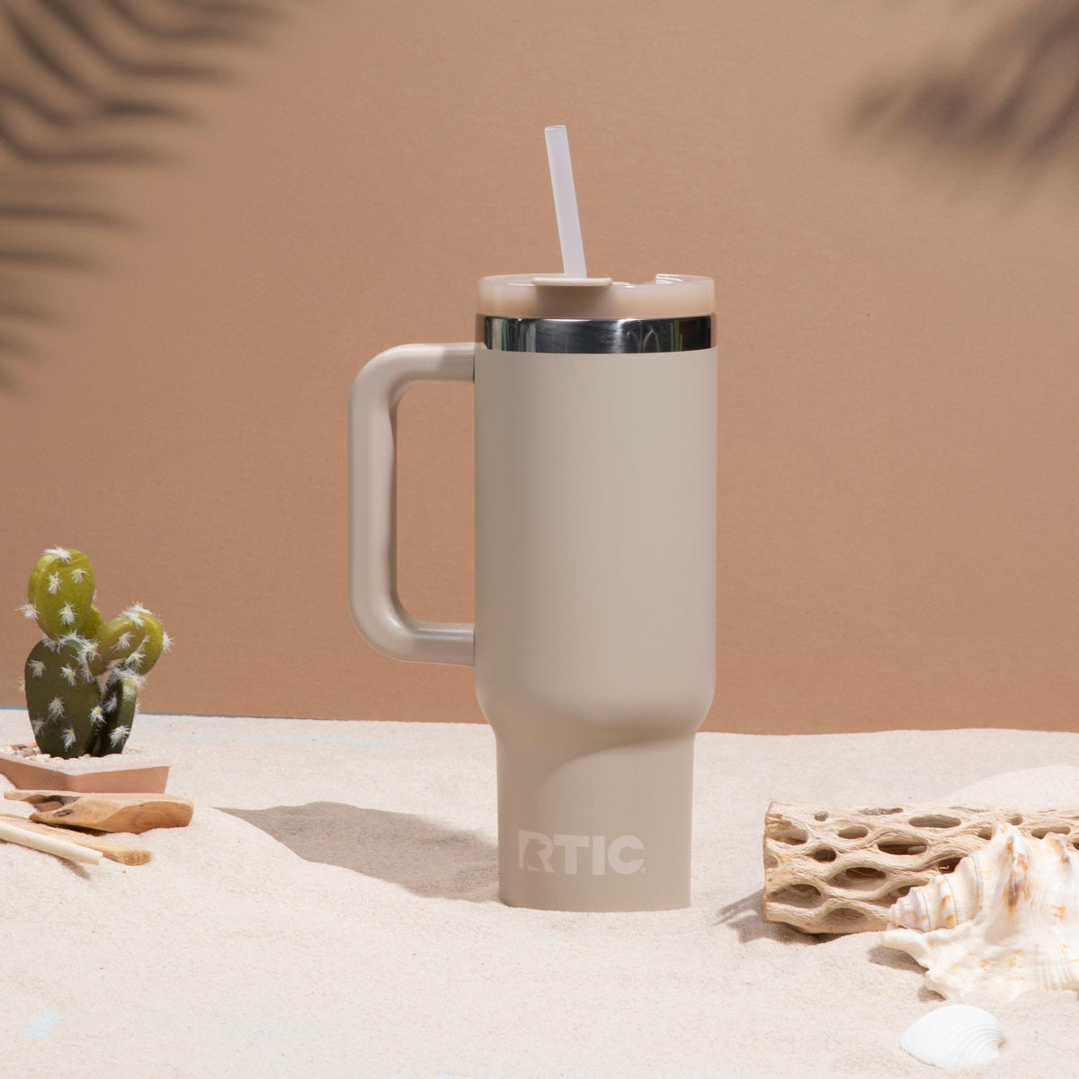 RTIC Road Trip Tumbler with handle fits car cup holders for travel.