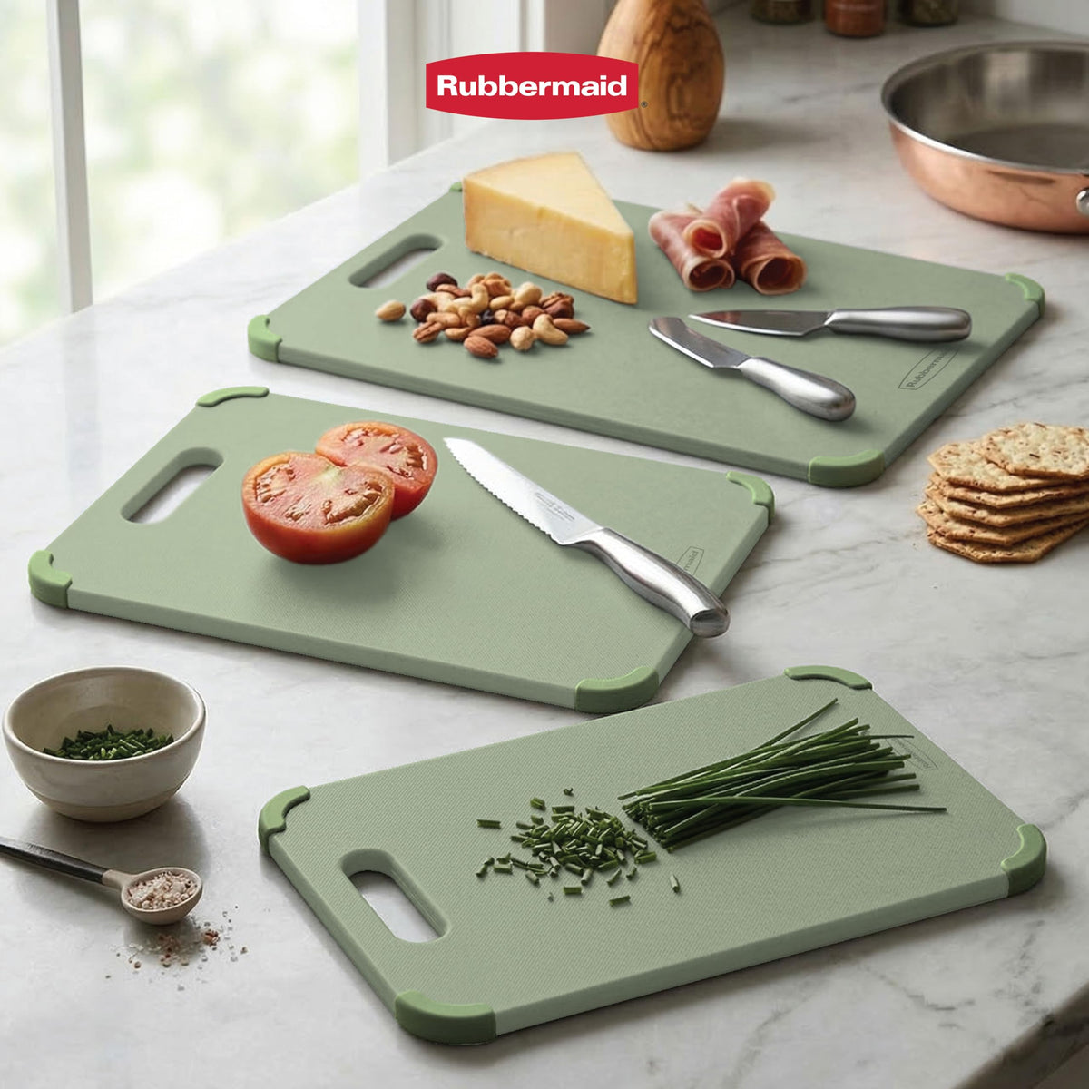 Rubbermaid reversible cutting boards separating raw meat and produce for safer prep.