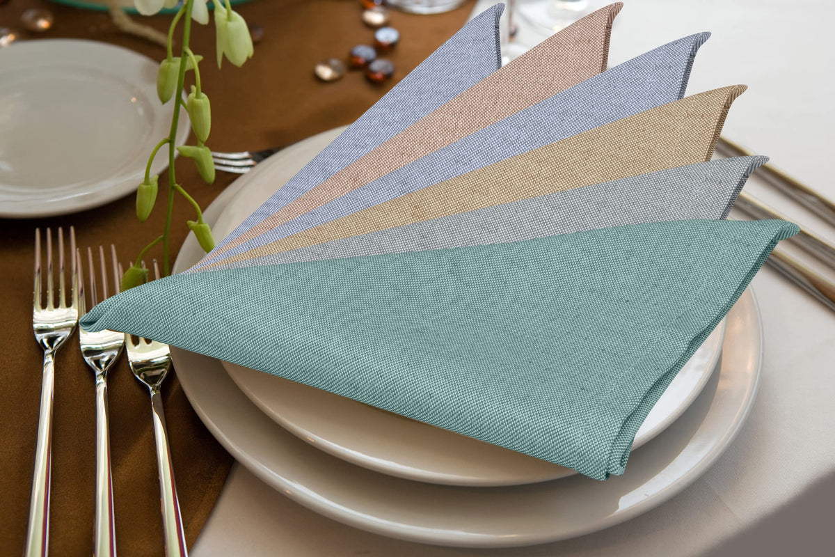 Machine-washable Ruvanti napkins demonstrated with easy care process.