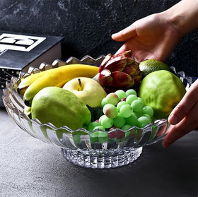 Rxcvkmw bowl on dining table with fruit creating an inviting centerpiece.