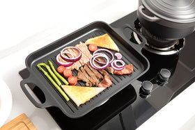 S·KITCHN induction-ready grill pan on stove for indoor grilling scenarios.