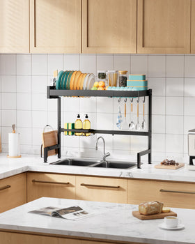 Sakugi two-tier rack supports plates, cups, and utensils efficiently.