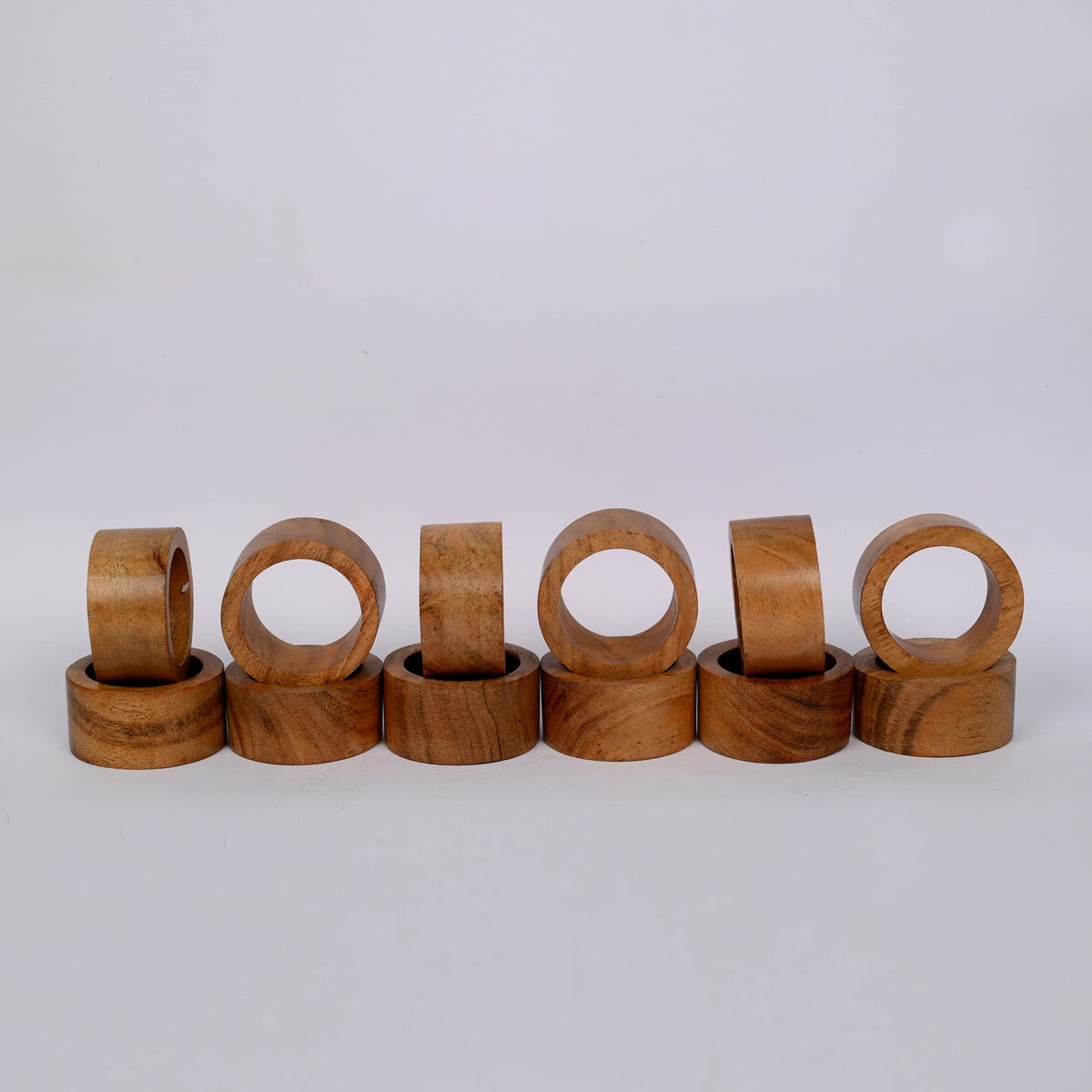Samhita acacia napkin ring closeup highlighting natural wood grain texture.
