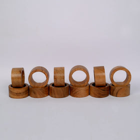 Samhita acacia napkin ring closeup highlighting natural wood grain texture.