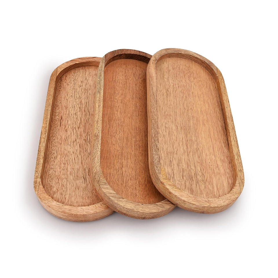 Samhita mango oval wood tray front view for cheese and fruit platters.