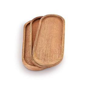 Samhita mango oval wood tray used to serve cheese and fruit at gatherings.