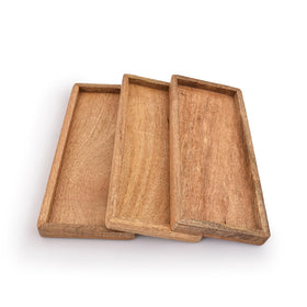 Samhita mango wood serving platter collection showcases warm grain for versatile party display.