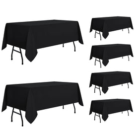 Sancua 6-pack white tablecloths laid on a dining table for a neat setup.