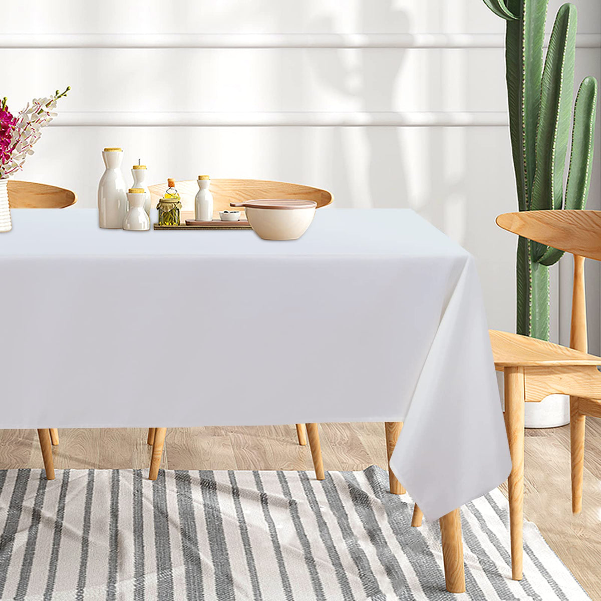 Sancua buffet layout with white tablecloths over a long serving table