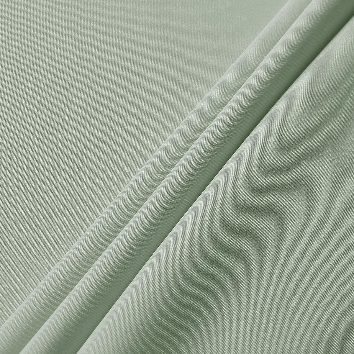Outdoor camping table covered with Sancua sage-green tablecloth.