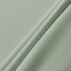 Outdoor camping table covered with Sancua sage-green tablecloth.