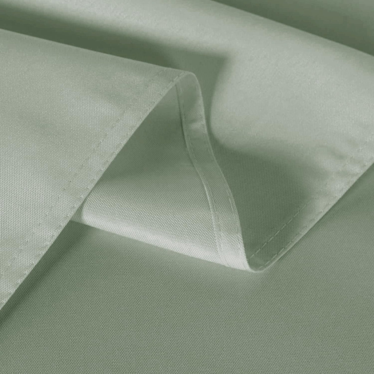 Sancua sage green tablecloth ready for a St Patrick's Day table