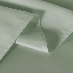 Sancua sage green tablecloth ready for a St Patrick's Day table