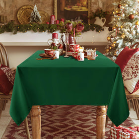 Sancua hunter green dining scene, adds elegant ambience to table setting.