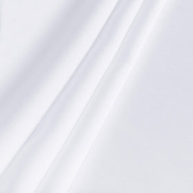 Sancua close-up of wrinkle-free finish on a white tablecloth