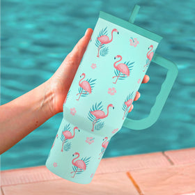 SANDJEST Flamingo 40oz tumbler being hand-washed to illustrate care guidance.