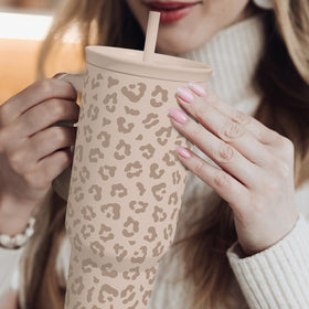 SANDJEST Leopard Tumbler in use during gym or travel