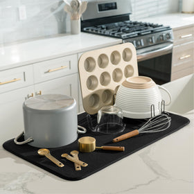 S&T INC. microfiber dish drying mat underneath dishes prevents drips on counters.