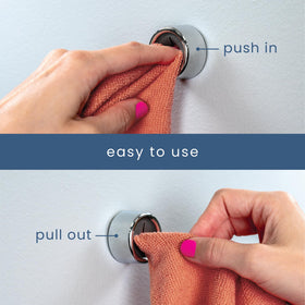 S&T INC round grey towel hook adheres to smooth surfaces for quick mounting.