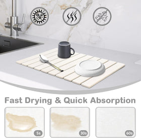 Sangukiro stone drying mat absorbing water droplets on a dish rack.