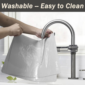 Sapid washable silicone mat being wiped clean with water