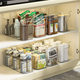SCPB two-pack clear bin with dividers arranged for pantry organization.