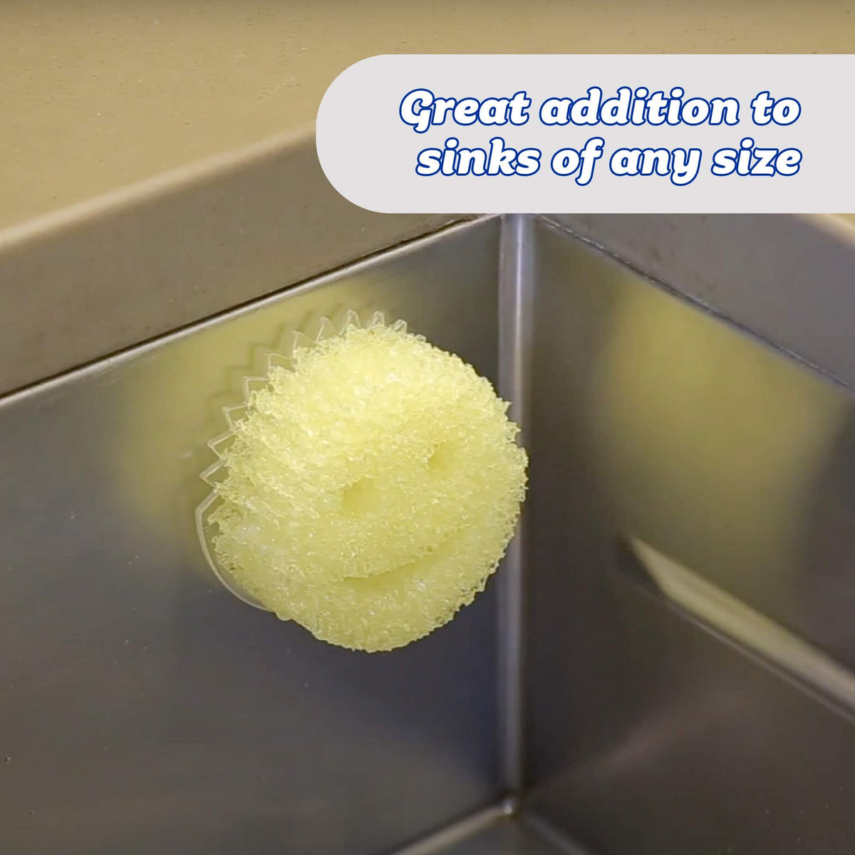 Slim, clear Scrub Daddy Caddy attached to a sink keeping sponges within reach