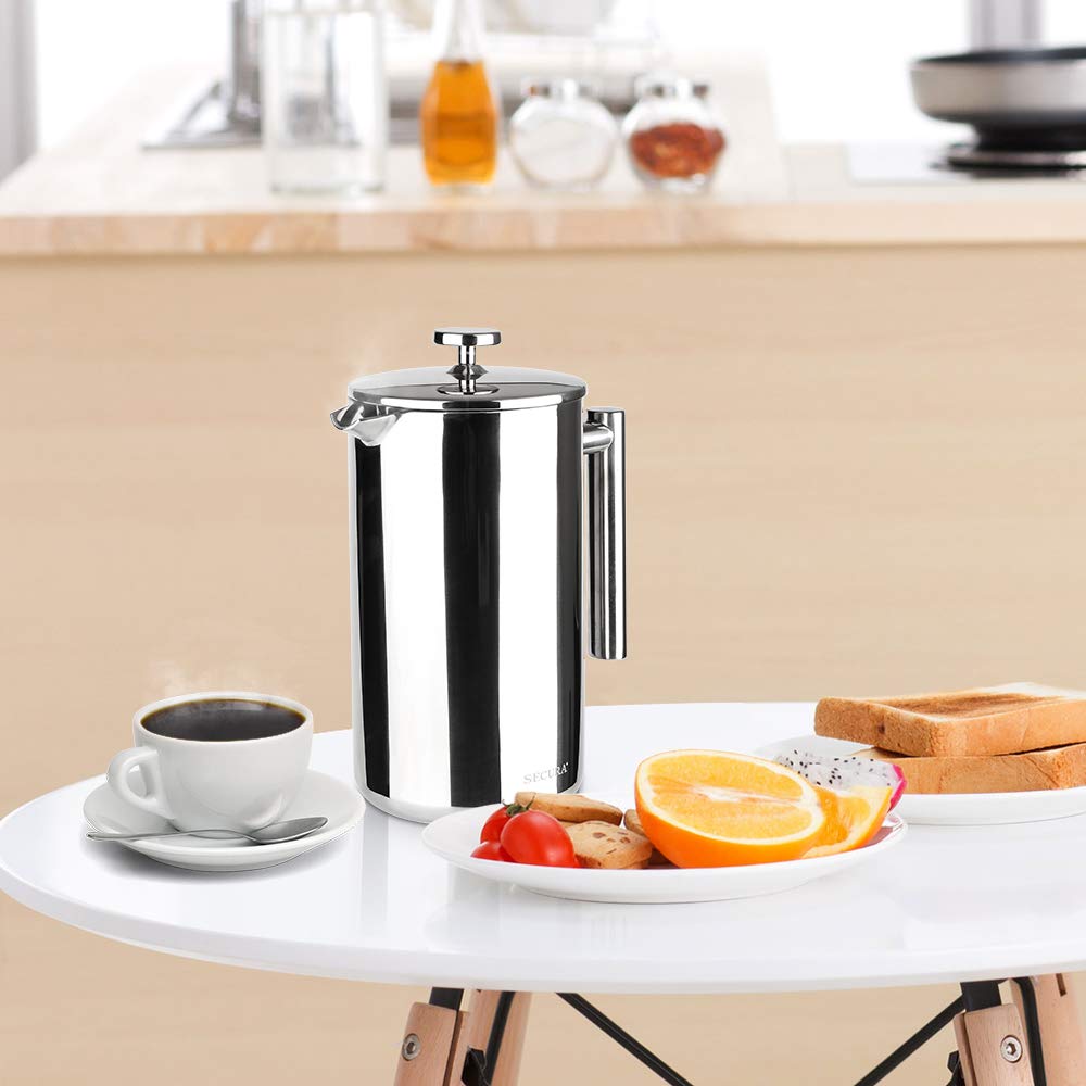 Secura French Press gift-ready packaging beside a coffee setup.