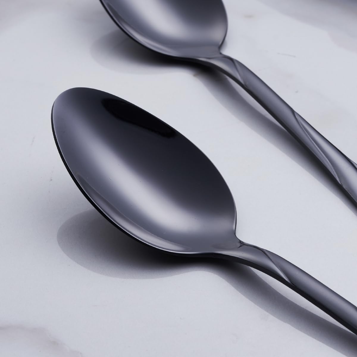 Seeshine black flatware full dining ensemble showcasing modern luxury at table.