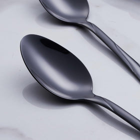 Seeshine black flatware full dining ensemble showcasing modern luxury at table.