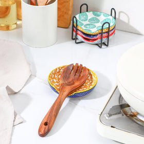 Selamica ceramic spoon rest with circular depression design holds utensils securely