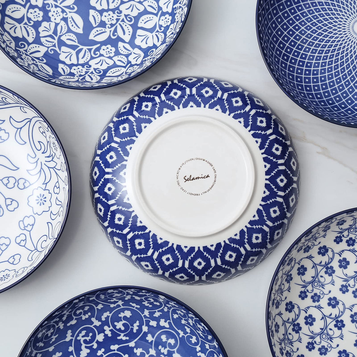 Selamica stylish bowls on a table setting for pasta and salads.