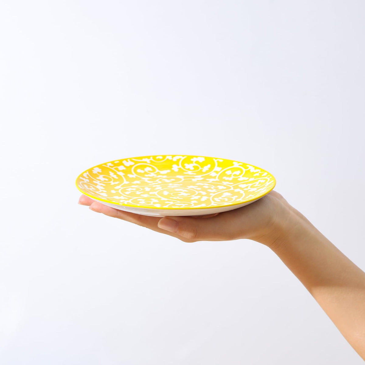 Selamica mini dinner plates feature a vibrant flower and geometric pattern for bright table styling