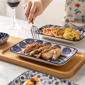 Selamica plates display sushi and appetizers with vibrant blue charm