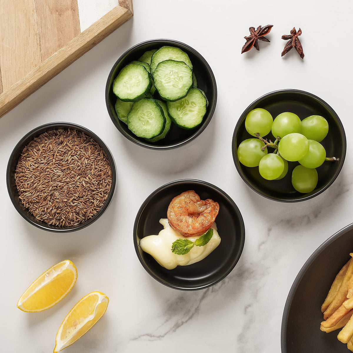Selamica sushi dipping bowls on a plate for soy sauce and condiments.