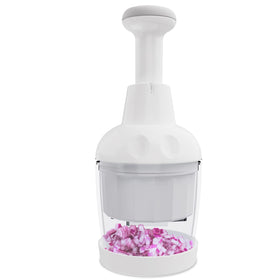 Semcide food chopper handheld on cap enables fast vegetable prep on a cutting board.