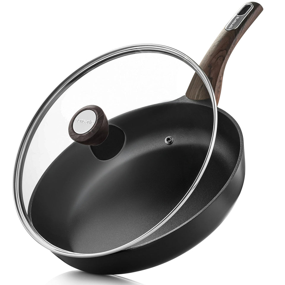 SENSARTE 11-inch nonstick frying pan with lid showing easy egg release with minimal oil.