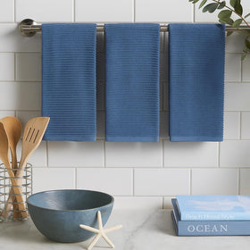 Serafina Home chambray towels multipurpose use in kitchen and décor.