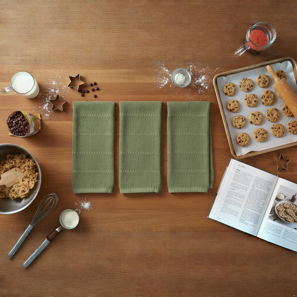 Serafina Home dark sage towels in use near sink for hands and spills.
