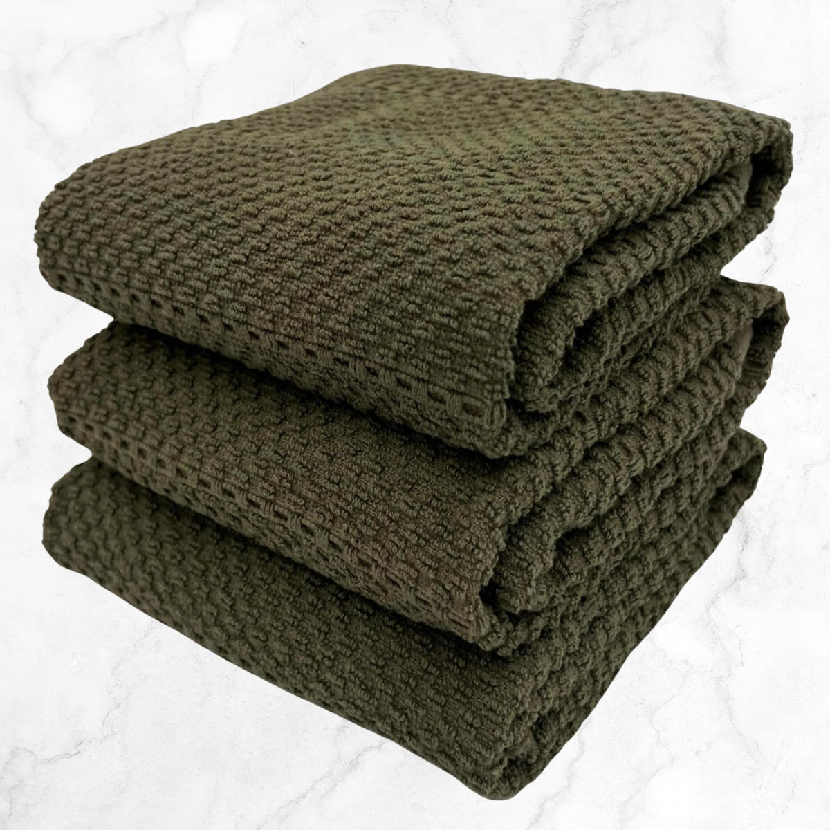 Decorative olive green towel by Serafina Home adding style to kitchen decor.