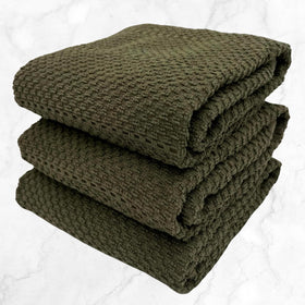Decorative olive green towel by Serafina Home adding style to kitchen decor.