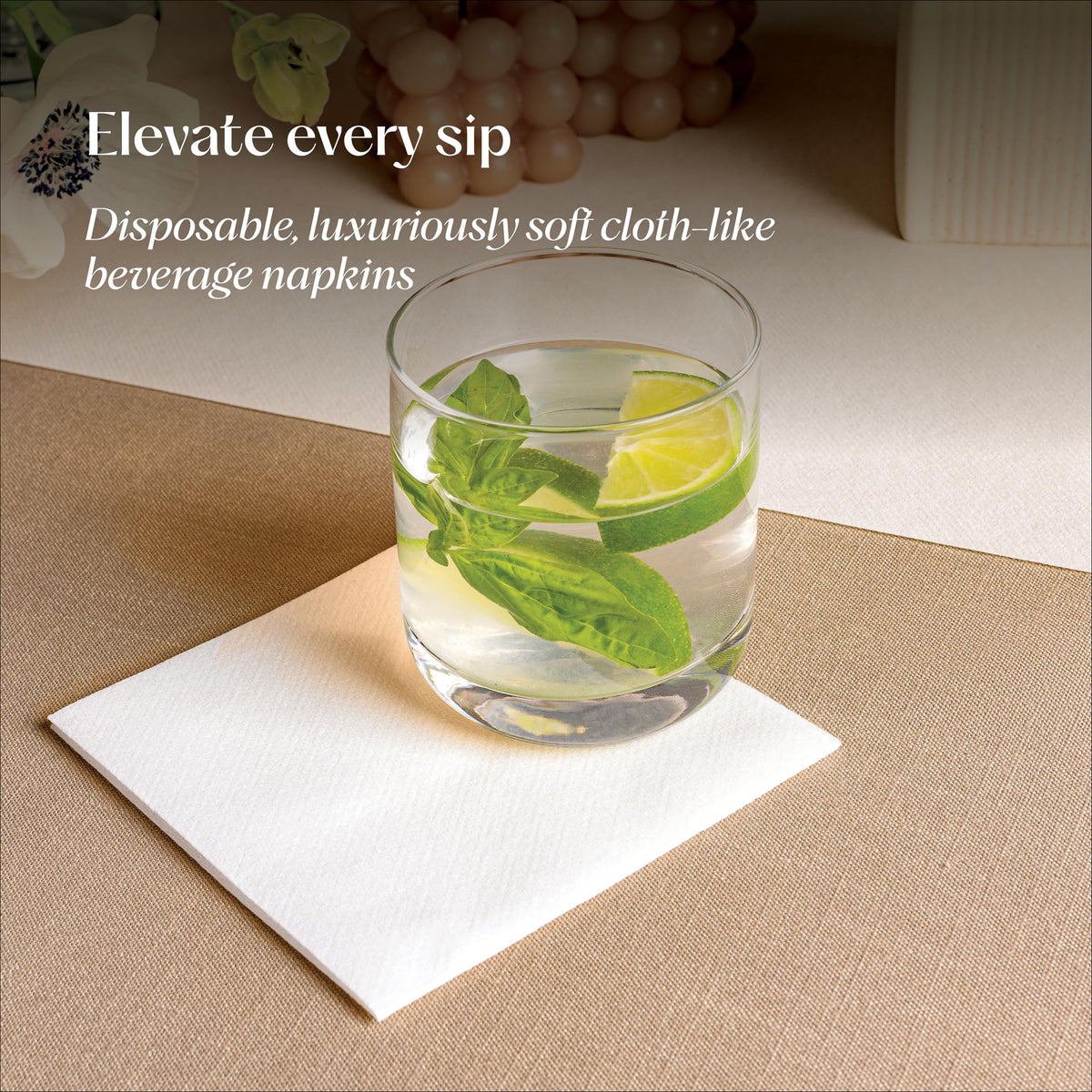 Servietto linen-like beverage napkins displayed beside cocktails for stylish service.