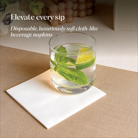 Servietto linen-like beverage napkins displayed beside cocktails for stylish service.