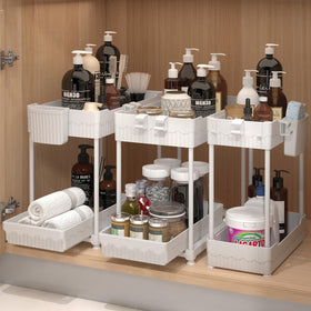 Sevenblue under-sink organizers with a two-tier sliding drawer for quick access to supplies.