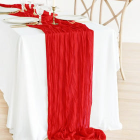 Seveups 10ft red cheesecloth table runner displayed on an elegant dining table