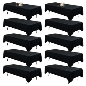 Seveups 10-pack black tablecloths on an 8ft banquet table for a cohesive wedding setup