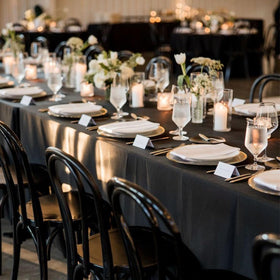 Seveups hemmed edge detail on a black tablecloth with seamless finish